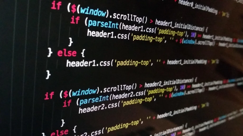 Developer looking at computer screen debugging Node.js memory leak with Chrome DevTools