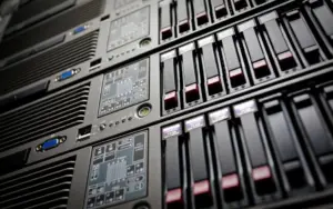 Server rack with database server in a data center, representing troubleshooting slow SQL queries